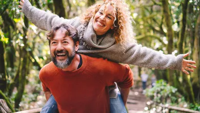 couple having fun together during a walk in the woods